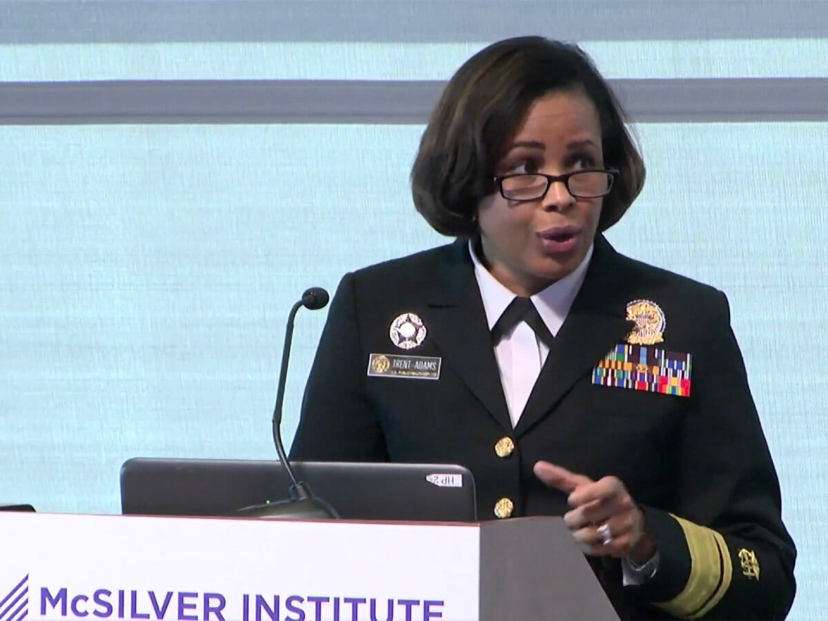 Deputy Surgeon General RADM Sylvia Trent-Adams speaking at a podium