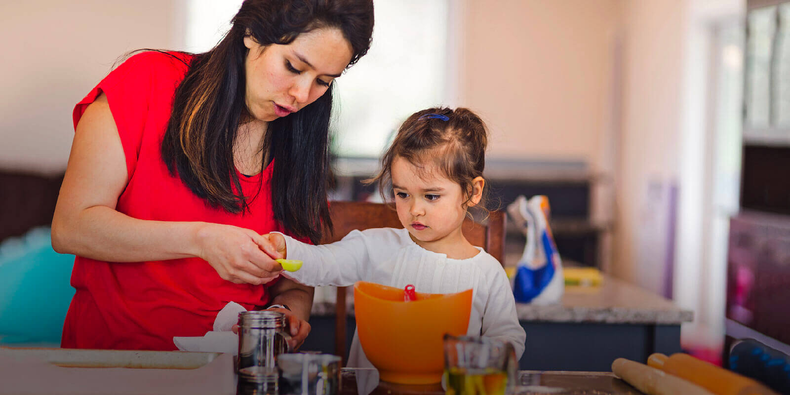Stock photo of mother and daughter cooking together
