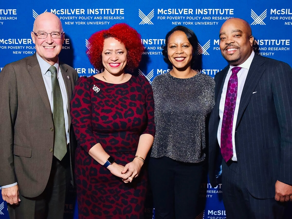 Photo of (left-to-right): NYU President Andrew Hamilton, Nikole Hannah-Jones, Dr. Christina Greer, and Dr. Michael Lindsey