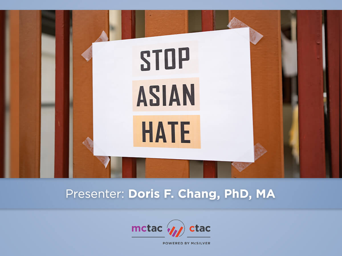 A sign reading "STOP ASIAN HATE" taped to a fence